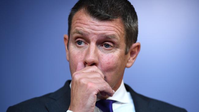 NSW Premier Mike Baird holds back tears as he announces his retirement. Picture: AAP/Paul Miller