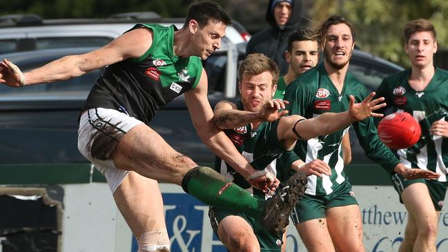 Greenvale big man Fabian Deluca gets a kick away. Picture: Hamish Blair