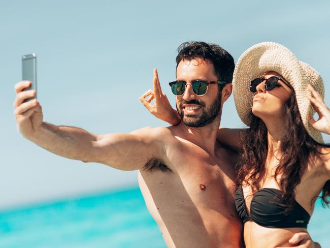 couple take a selfie on the beach in summer  Picture: istock
