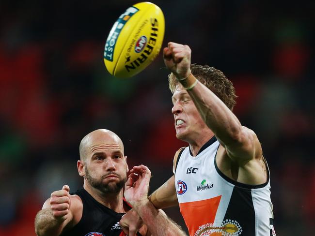 Sam Frost spoils the ball away from Paul Chapman. Picture: Toby Zerna