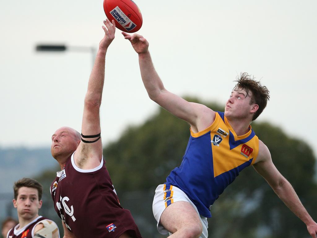 Ballarat: Melton’s Brett McIntyre and Liam Stow of Sebastopol battle in the ruck. Picture: Hamish Blair