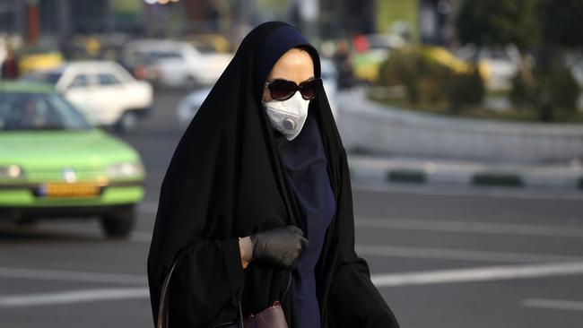 A woman wearing a face mask in western Tehran, Iran, on Saturday.