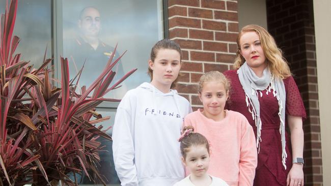 FIFO worker James in quarantine at his home in Launceston with his wife Jarrah and their children Harper, 11, Olivia, 9, and Quinn, 4, outside. Picture: PATRICK GEE