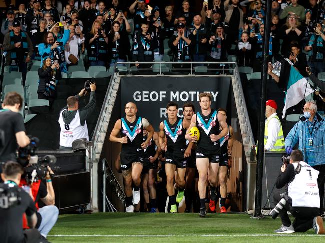 ADELAIDE, AUSTRALIA - OCTOBER 01: The Power prepare to enter the arena during the 2020 AFL First Qualifying Final match between the Port Adelaide Power and the Geelong Cats at Adelaide Oval on October 01, 2020 in Adelaide, Australia. (Photo by Michael Willson/AFL Photos via Getty Images)