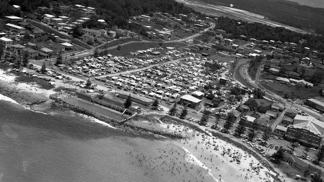 On the left in this aerial view is the beach swimming pool, with the main surfing beach on the right in 1961. Picture by Norm Lye. 