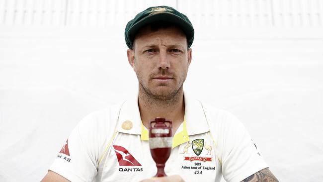 James Pattinson holds a replica of the Ashes urn after he was named in the Australian squad for the series. Picture: Getty Images