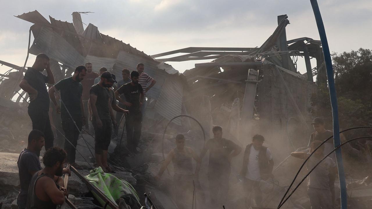 Palestinians inspect the site of an Israeli strike in al-Zawayda in the central Gaza Strip on August 17, amid the ongoing conflict between Israel and the militant group Hamas. Picture: AFP