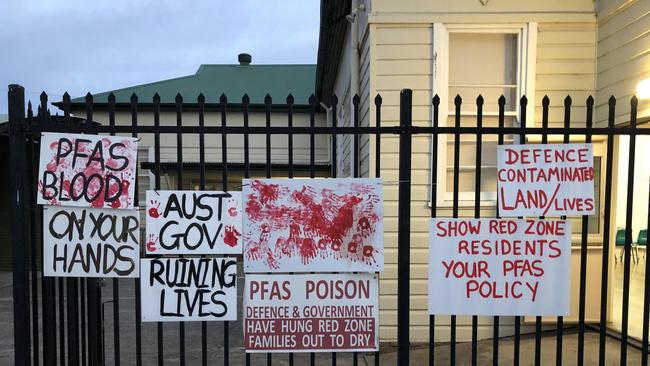 Signs put up by residents on PFAS contamination. Picture: Chris Fogarty.