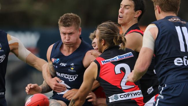 Lee Hoey of South Adelaide battles Kenneth Karpany of West Adelaide. Picture: Courtesy of Nick Hook Photography