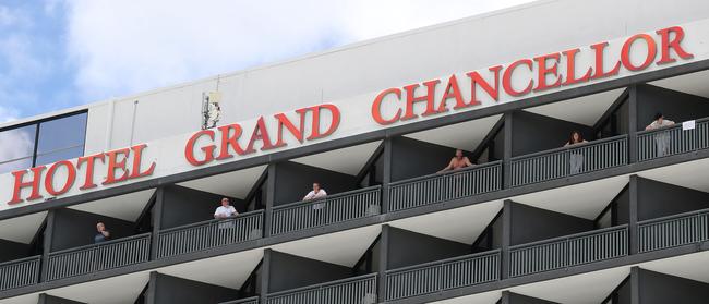 Guests in quarantine on the balcony of Hotel Grand Chancellor. Picture: Tara Croser.