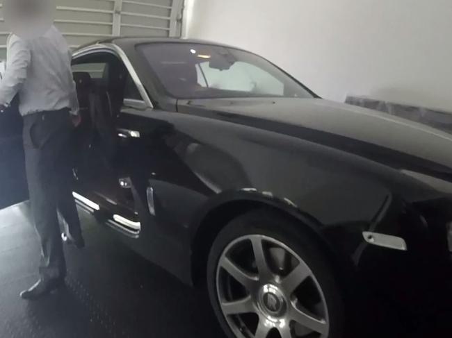 Richard Marlborough exits his Rolls Royce at the family’s Hope Island home in February. Picture: Queensland Police Service