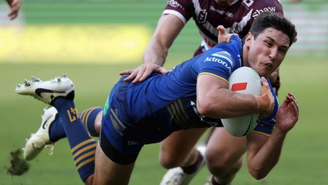 SYDNEY, AUSTRALIA - MARCH 24: Mitchell Moses of the Eels scores a try during the round three NRL match between Parramatta Eels and Manly Sea Eagles at CommBank Stadium, on March 24, 2024, in Sydney, Australia. (Photo by Cameron Spencer/Getty Images)