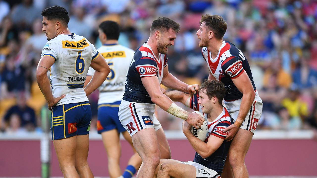 Roosters players congratulate Sam Walker after his try against Parramatta. Picture: Albert Perez/Getty Images