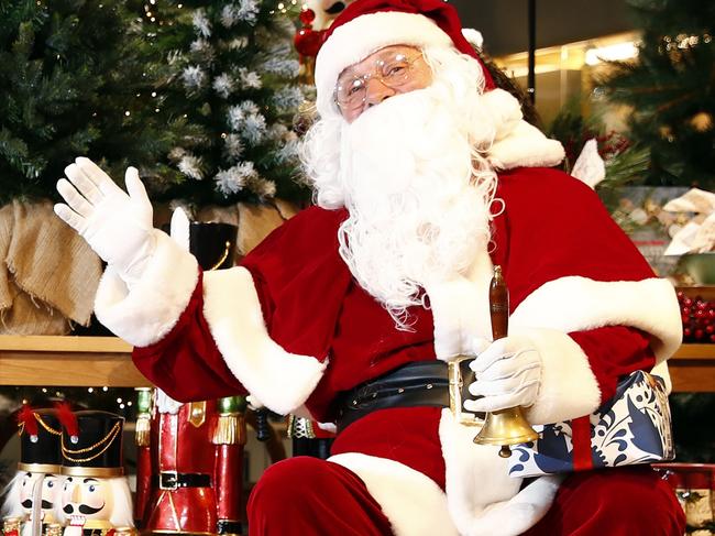 WEEKEND TELEGRAPHS - 7/10/20MUST NOT USE BEFORE CHECKING WITH WEEKEND TELEGRAPH PIC EDITOR JEFF DARMANIN - Santa Clause visits kids at David Jones in the Sydney CBD store this afternoon. L to R, Matthew Nader, Jacob and Zoe Hipolito and  Santa. Picture: Sam Ruttyn