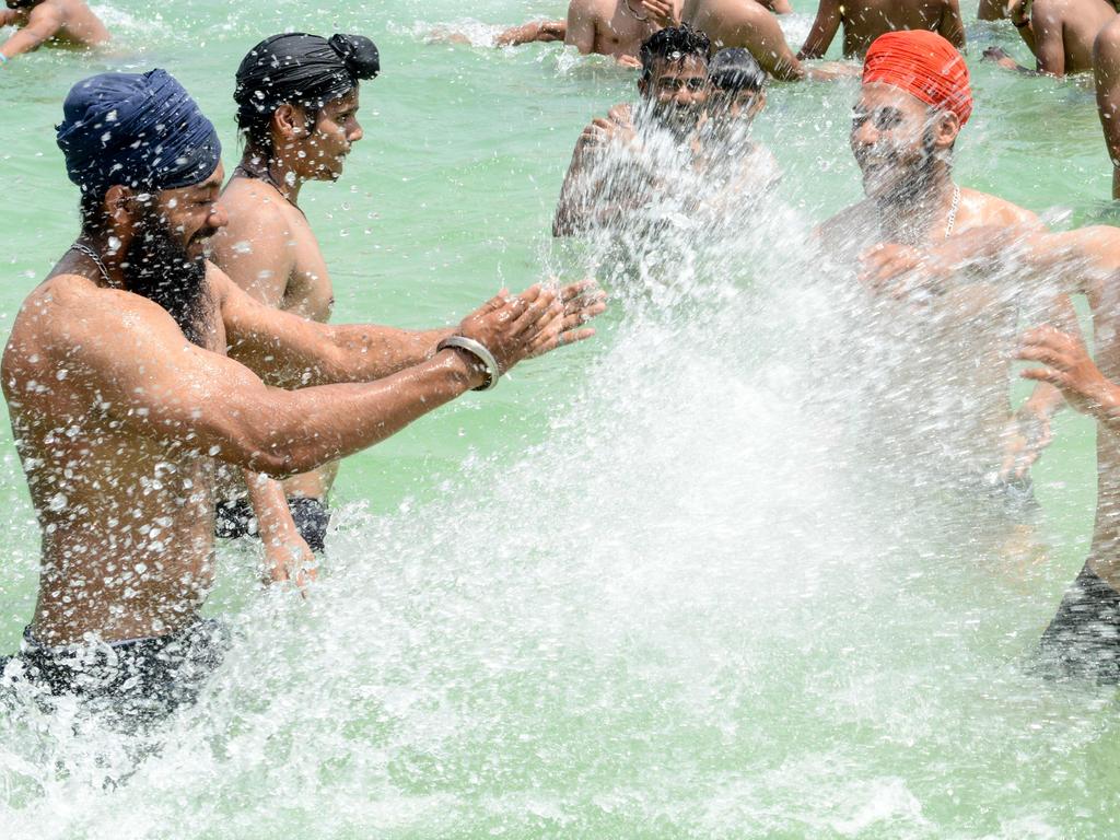 Indian youths play in a swimming pool on a hot summer day on the outskirts of Amritsar on June 2, 2019. Picture: Narinder Nanu/AFP