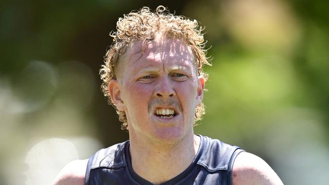 MELBOURNE, AUSTRALIA - NOVEMBER 22: Clayton Oliver of the Demons runs laps during a Melbourne Demons AFL training session at Gosch's Paddock on November 22, 2024 in Melbourne, Australia.  (Photo by Quinn Rooney/Getty Images)