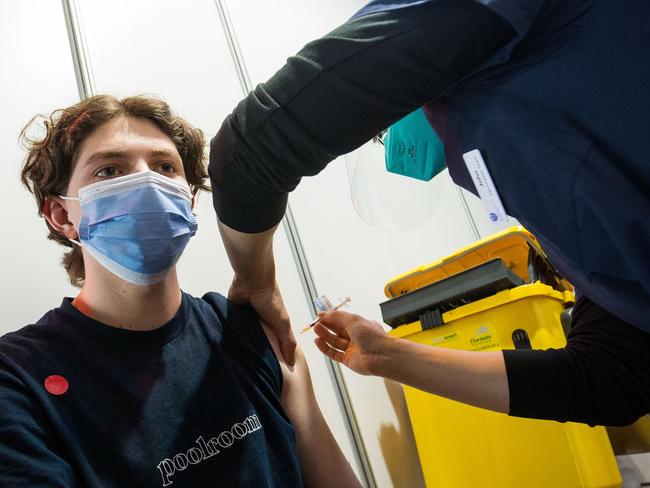 A young man receives the pfizer vaccine at the Royal Exhibition Building Vaccination Centre in Carlton on August 25, 2021. Picture: Getty Images