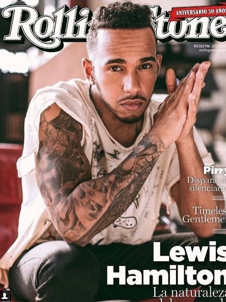 Tapping into the bad-boy look with heavily tattooed arms on the cover of Rolling Stone magazine.