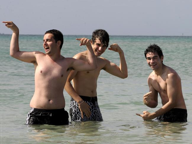 Cousins from Glenroy, (from left) David, Stephen, Vince, Michael and Rocky have a swim for the last time in 2008, before celebrating the new year in Rye. Picture: Nicole Garmston