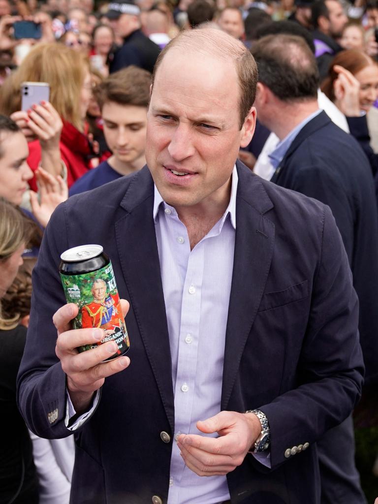 Prince William, Prince of Wales holds a can of Organic Coronation Ale as he speaks to people during a walkabout meeting. Picture: Getty Images