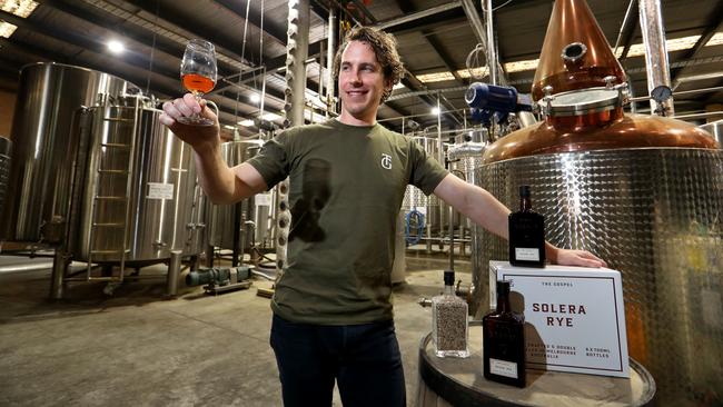 Gospel Whiskey co-founder Ben Bowles raises a glass to bold futures. Picture: David Geraghty