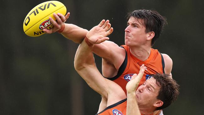 SYDNEY, AUSTRALIA - FEBRUARY 27: Sam Taylor and Toby Greene contest the ball during a GWS Giants AFL training session at VAILO Community Centre on February 27, 2024 in Sydney, Australia. (Photo by Mark Kolbe/Getty Images)