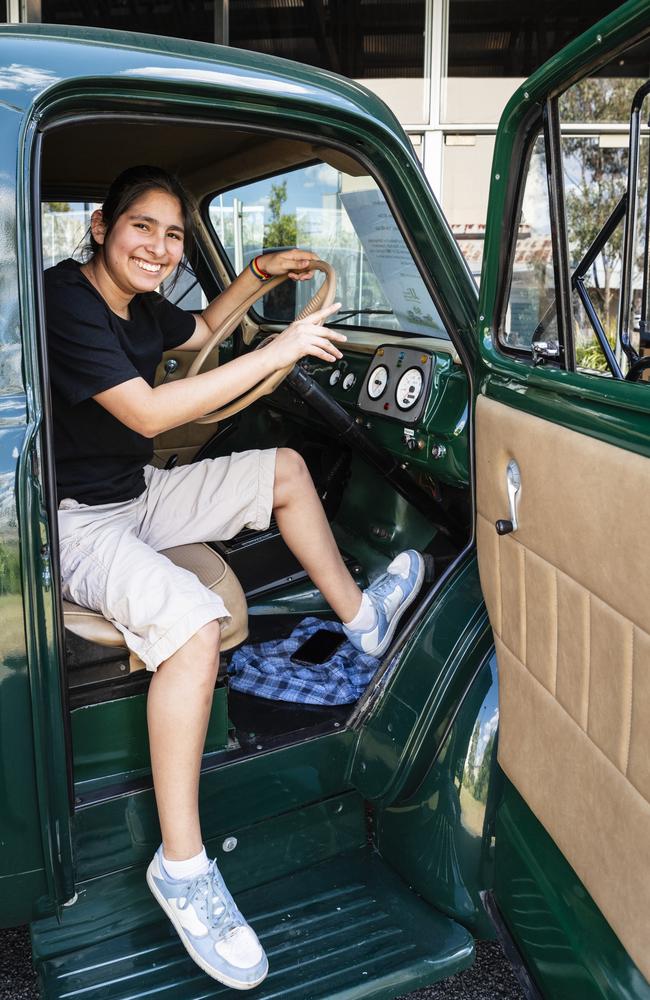 Victoria Ramos sits in the JJ Richards replica Bedford that operated in Toowoomba in 1962 at the expo. Picture: Kevin Farmer