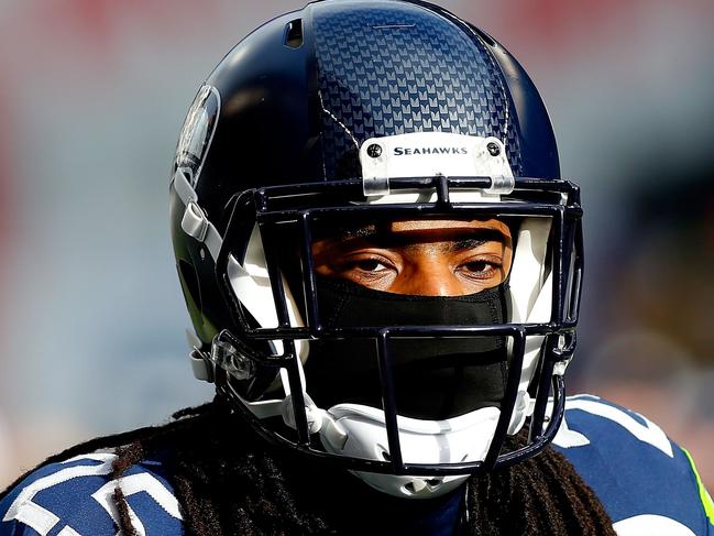 SEATTLE, WA - JANUARY 18: Richard Sherman #25 of the Seattle Seahawks looks on before the 2015 NFC Championship game at CenturyLink Field on January 18, 2015 in Seattle, Washington. Tom Pennington/Getty Images/AFP == FOR NEWSPAPERS, INTERNET, TELCOS & TELEVISION USE ONLY ==