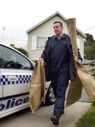 A forensic officer gather evidence in the case.  Picture: Colin Murty