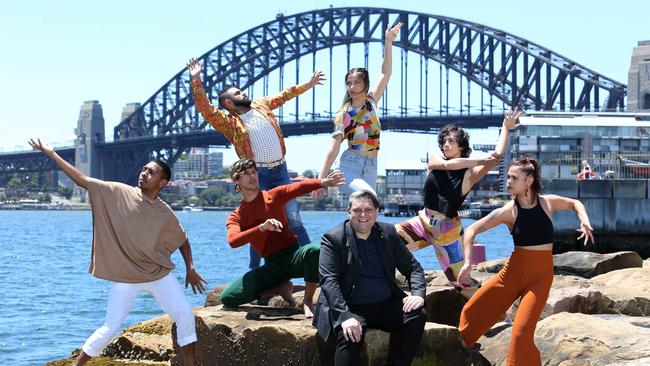 Sydney Festival’s Wesley Enoch, seated, with Bangarra Dance Theatre members. Picture: Britta Campion