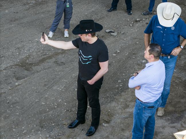 EAGLE PASS, TEXAS - SEPTEMBER 28: An aerial view of tech entrepreneur Elon Musk, wearing a black Stetson hat, livestreaming while visiting the Texas-Mexico border on September 28, 2023 in Eagle Pass, Texas. Musk toured the border along the bank of the Rio Grande with Rep. Tony Gonzales (R-Texas) to see firsthand the ongoing migrant crisis, which he has called a 