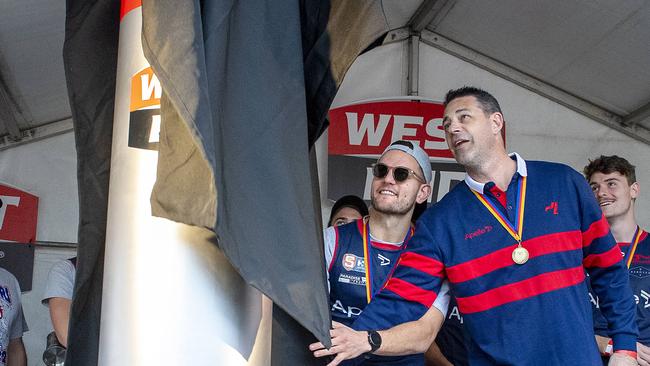 Norwood Coach Jade Rawlings and captain Matt Nunn unveil the mini chimney during the SANFL premiership chimney unveiling at the Brickworks Marketplace in 2022. Picture: Mark Brake