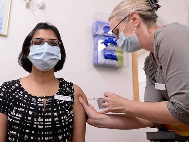 MELBOURNE, AUSTRALIA - NewsWire Photos MARCH 15, 2021: Dr Sumi Bhaskaran, Director, General Medicine, receives her second Pfizer COVID-19 vaccine from Immunisation Nurse Emily at Monash Medical Centre. Picture: NCA NewsWire / Andrew Henshaw