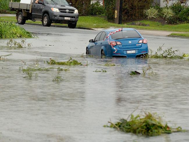 A car stuck in floodwaters at Airlie Beach. Picture: Alix Sweeney