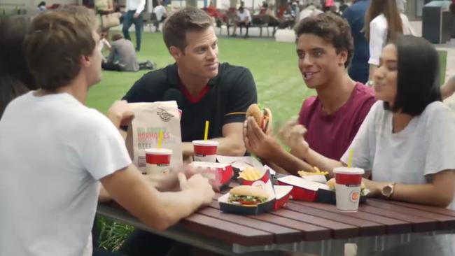 Young Crows forward Ben Davis tucks into a Whopper in a Hungry Jacks TV commercial, filmed before he was recruited by Adelaide.