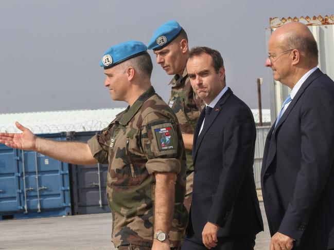 French Minister of the Armed Forces Sebastien Lecornu, centre, visits the base of the French contingent of the United Nations Interim Forces in Lebanon (UNIFIL) in the southern Lebanese village of Deir Kifa. Picture: AFP