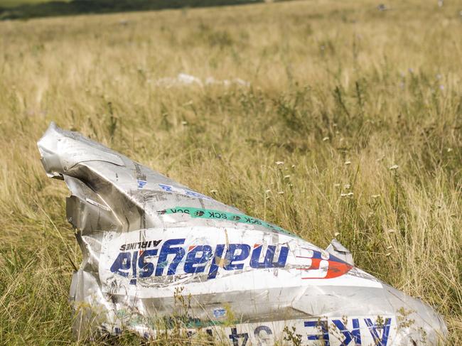 GRABOVO, UKRAINE - JULY 22: Wreckage from Malaysia Airlines flight MH17 lies in a field on July 22, 2014 in Grabovo, Ukraine. Malaysia Airlines flight MH17 was travelling from Amsterdam to Kuala Lumpur when it crashed killing all 298 on board including 80 children. The aircraft was allegedly shot down by a missile and investigations continue over the perpetrators of the attack. (Photo by Rob Stothard/Getty Images) *** BESTOF2014 *** YEARINREVIEW ***