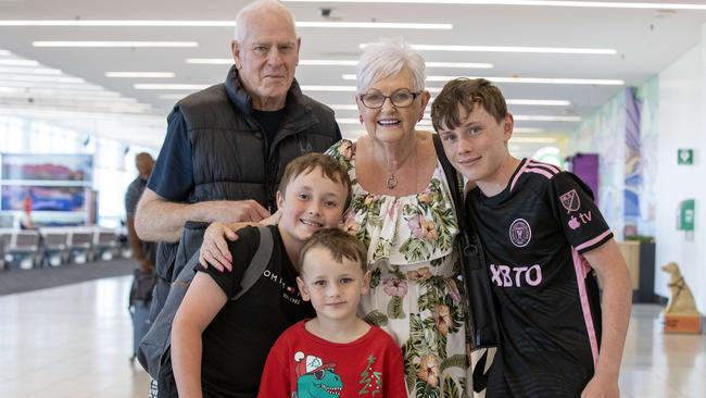 John and Annette Taylor from Grange with their Grandkids Josh 8. Austin 5 and Lawrence 13 who were passengers on the Qantas flight. Picture: Kelly Barnes