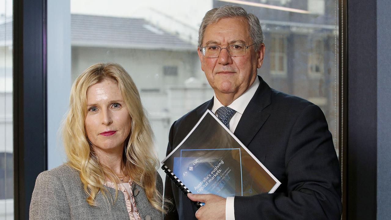 Commissioner Simone Constant and Chair Joe Longo with the ASIC report into Australia's evolving capital markets. Picture: John Appleyard / Snappleyard