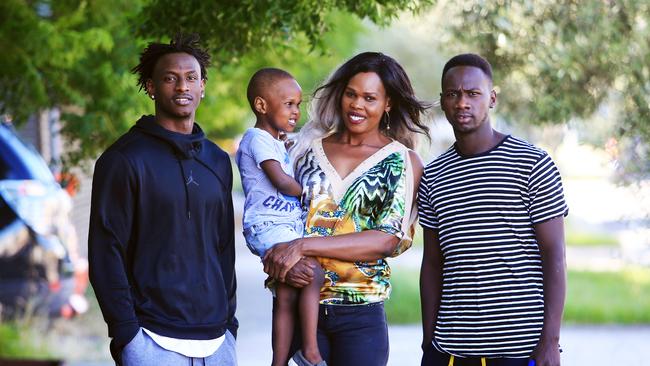 1/1/18 Aluel Kuol with her sons (L-R) Bolis Daw (18), Aleu Deng (3) and Deng Daw (23). She arrived in Australia from South Sudan in 2008. She is a leader in the local Sudanese Dinka community and says there is a real problem with youth disconnecting from their families as well as from authorities. Says families have a central role to play in curbing youth crime. Aaron Francis/The Australian