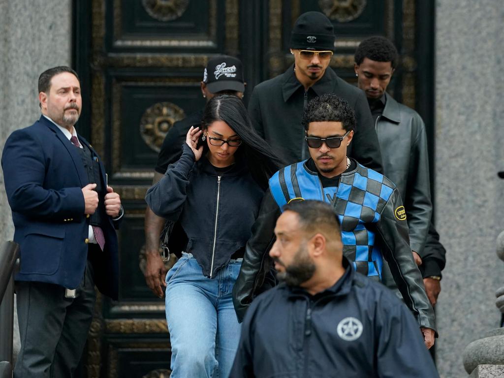 Justin Combs, at front, and Christian Combs, at rear, leave their father’s bail hearing. Picture: AFP