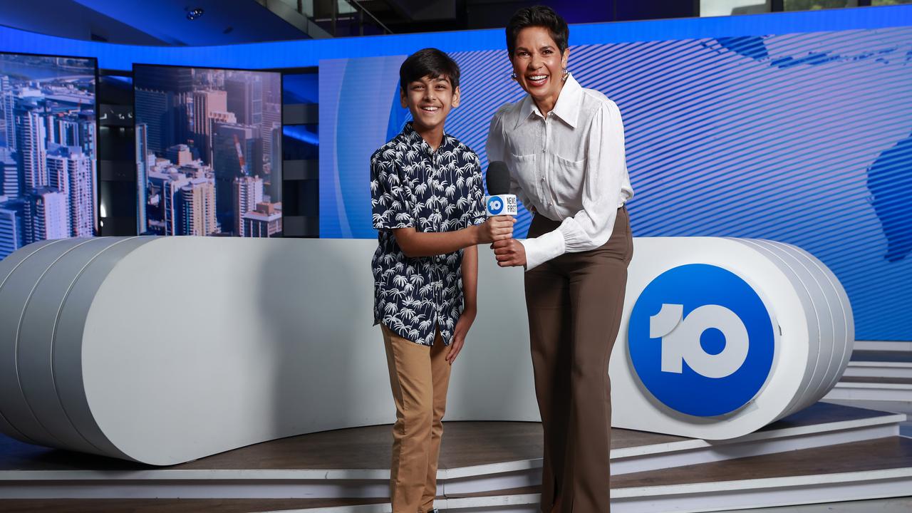 Kids News junior reporter Aditya Paul, 11, checks out the Network 10 studio with presenter Narelda Jacobs. Picture: Justin Lloyd