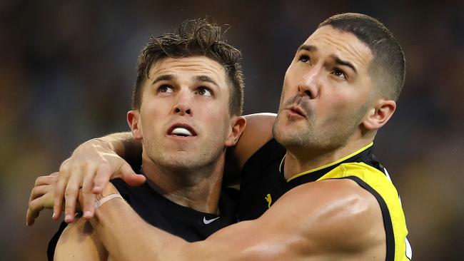 Things were tight at the MCG, as shown by Marc Murphy and Shaun Grigg. Pic: Michael Klein