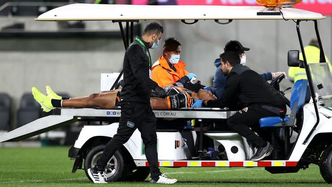 Wests Tigers forward Michael Chee Kam is taken from field during the match against Parramatta at Bankwest Stadium. Picture: Phil Hillyard