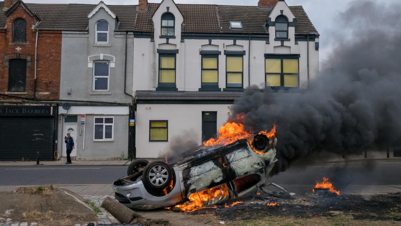 A car burns after it was set on fire during a demonstration in Middlesbrough. Picture: Getty Images