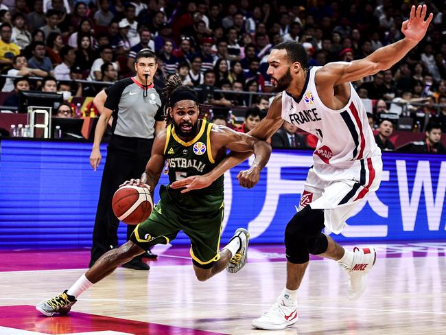 Buckets of talent ... Patty Mills in control against France in the FIBA World Cup.