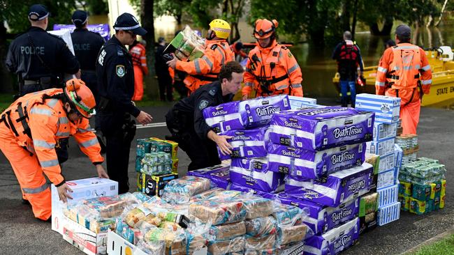 Members of the State Emergency Service prepare medical supplies and relief goods to take to flood-affected residents during rescue operations in Windsor. Picture: AFP