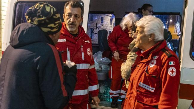 Italian Red Cross volunteers have begun carrying out night time street patrols and giving blankets, hot meals and first aid to rough sleepers. Picture: supplied