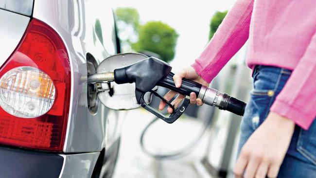 Lady pumping gasoline fuel in car at gas station. Picture: kasto80