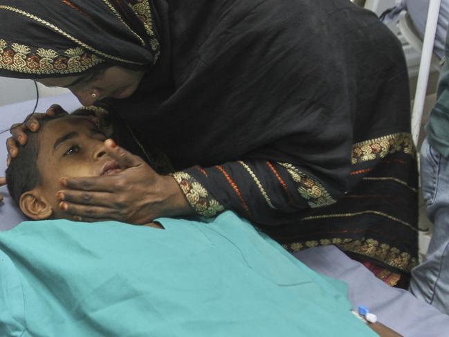 A mother comforts of her child injured in an Indian missile attack, at a hospital in Bahawalpur, Pakistan's Punjab province, Wednesday, May 7, 2025. (AP Photo/Asim Tanveer)